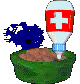 Bluescreen sits in front of the green food bowl with his eyes closed as the user puts medicine from the white and red medicine bottle into it.