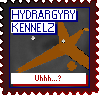 A very odd and almost twig-like orange pet in Petz looks at the camera. The text reads 'Hydrargyry Kennelz' at the top and 'Uhhh...?' at the bottom. The stamp is primarily black and red on the borders, with the text being white, blue, and red.